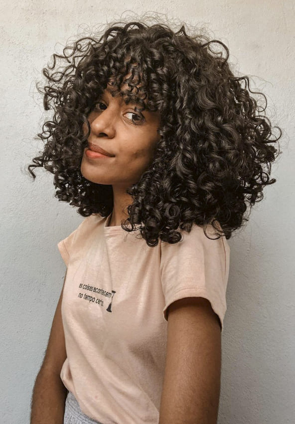 Medium black women curly hairstyles with bangs