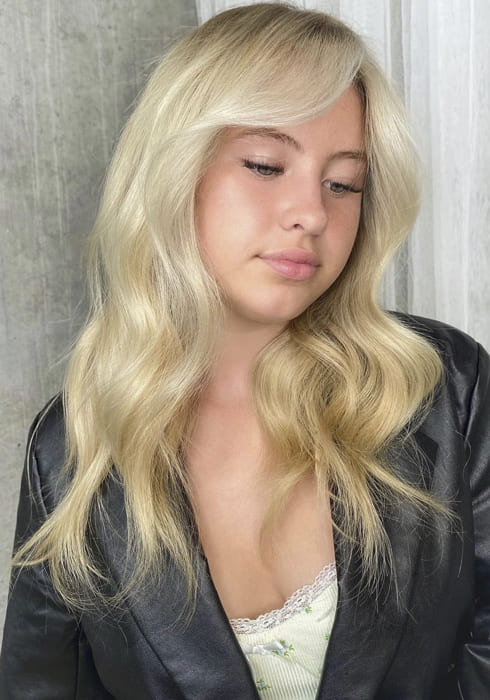 Long blonde wavy hairstyles with bangs