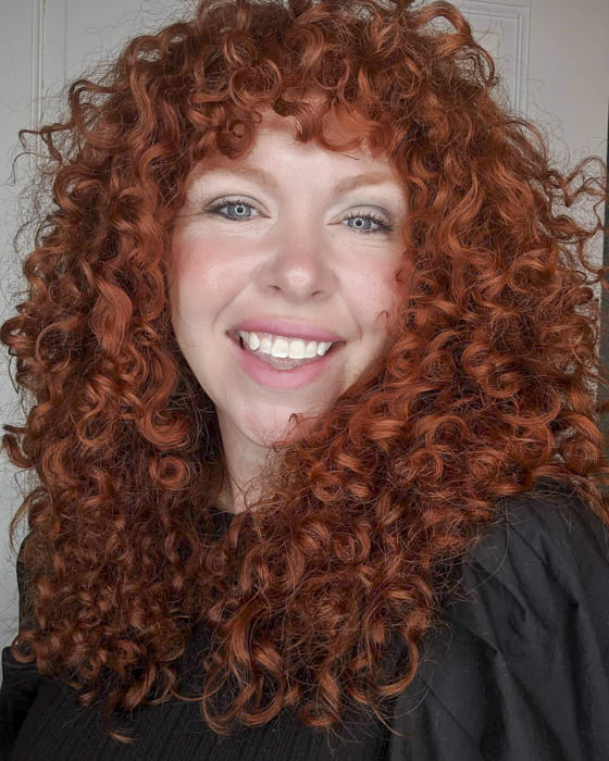 awesome red long curly hairstyles with bangs