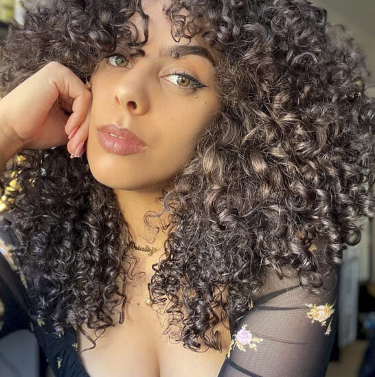 black women long curly hairstyles with bangs