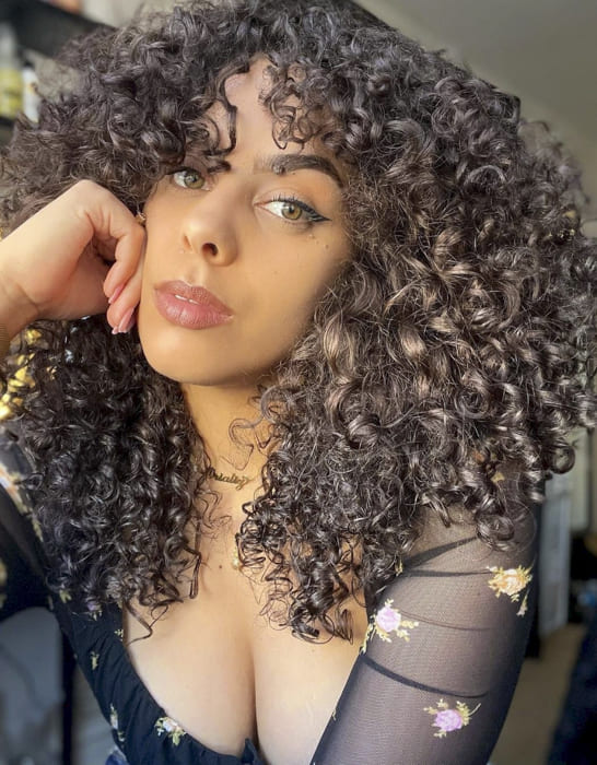 black women long curly hairstyles with bangs