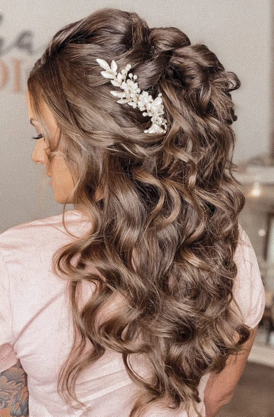 Curly and voluminous half up half down wedding hairstyles