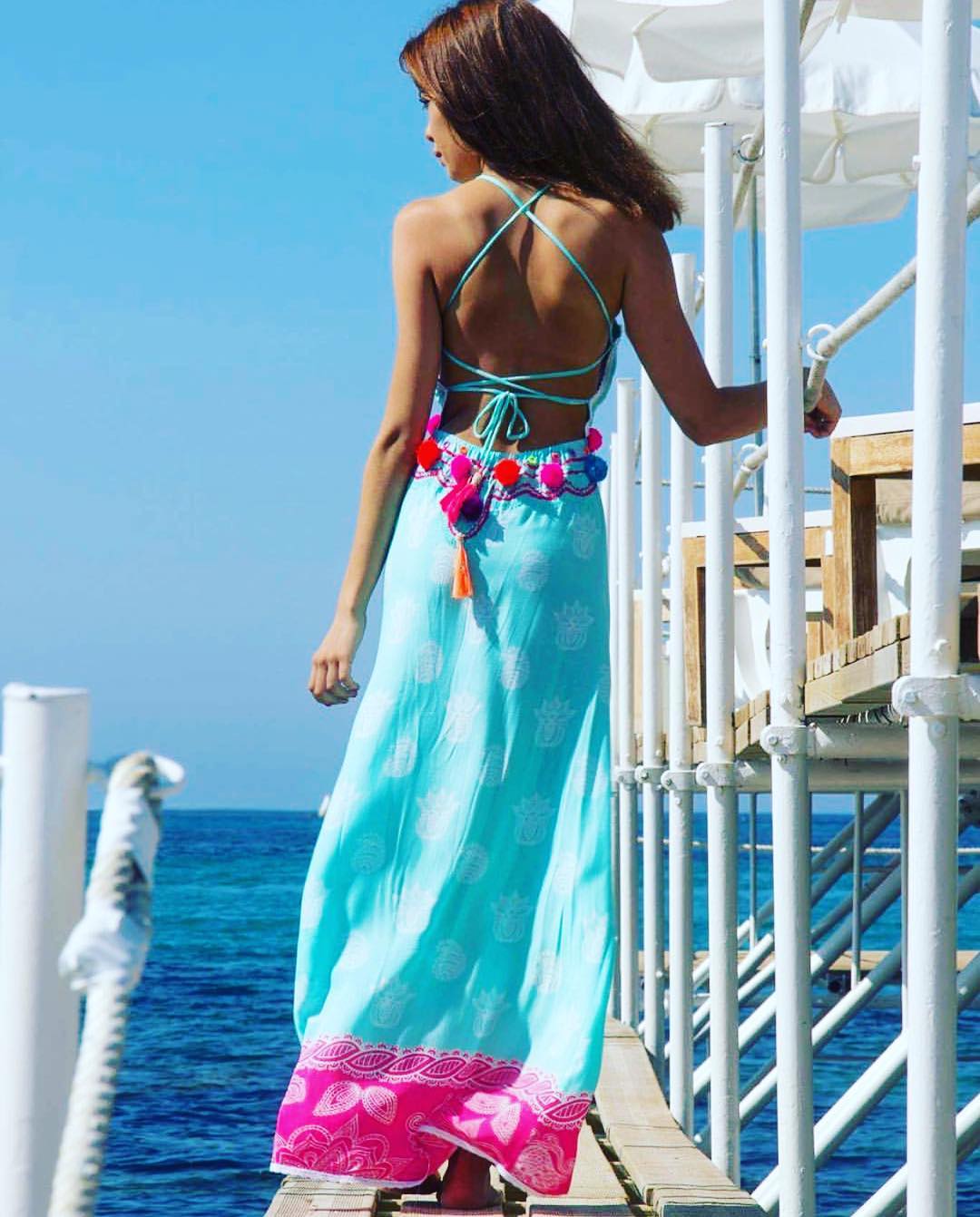 Turquoise dress worn by the sea