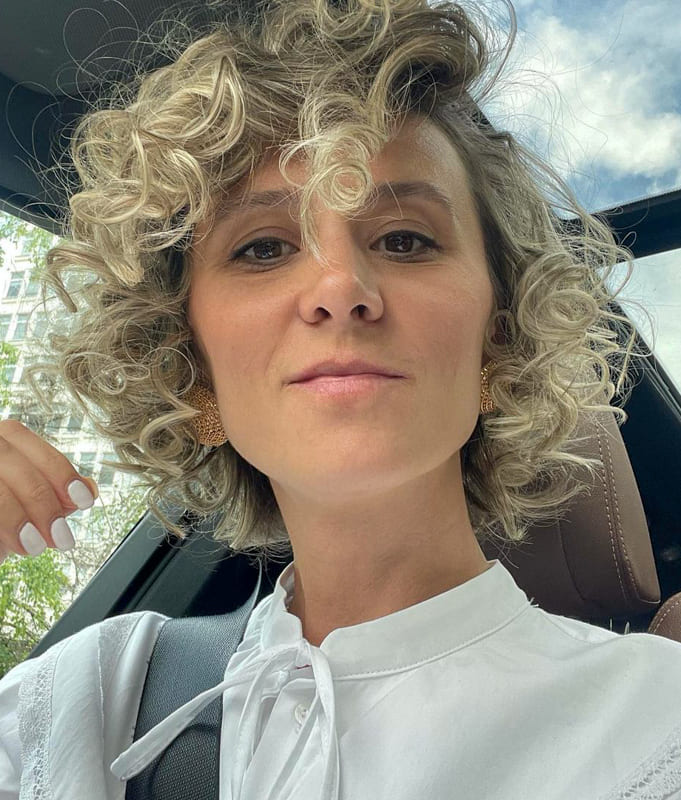 Short blonde curly hair