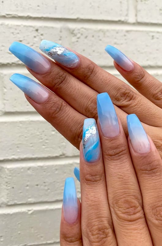 Soft blue and glitter ombre nails