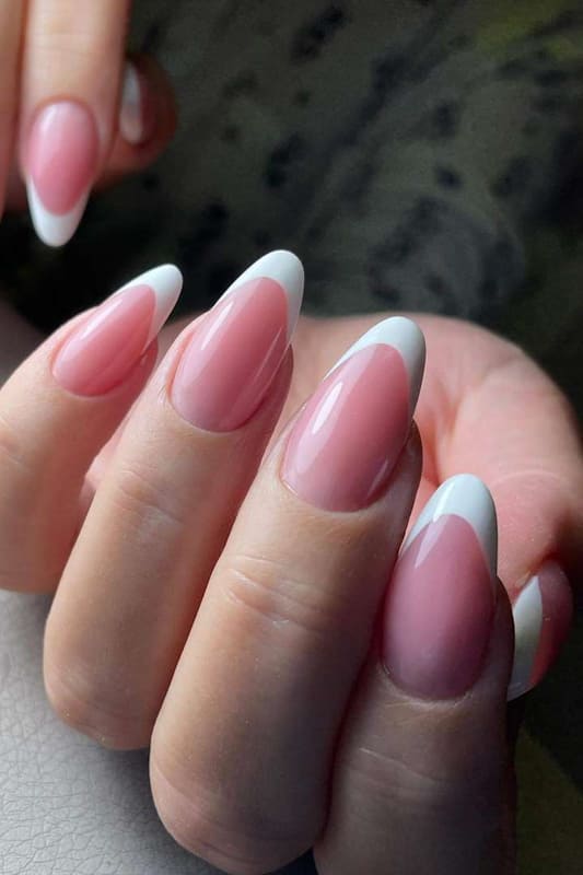 Nails design is in the form of square, color is natural pink, red and  white. A