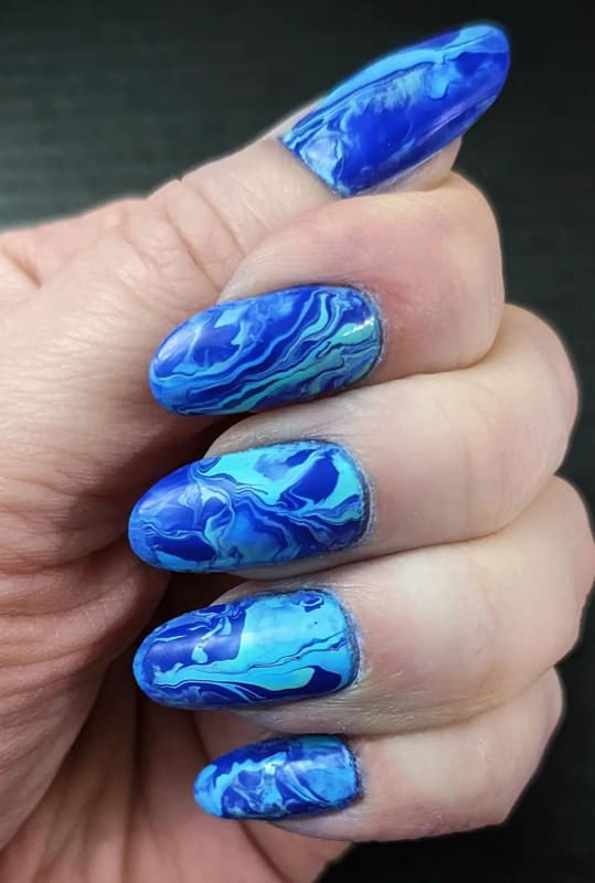Almond blue marble nails