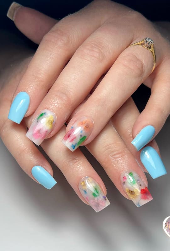 Pastel blue nails with flowers