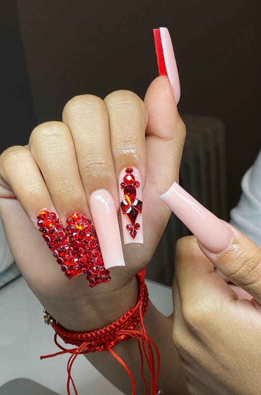 Long nude and red acrylic nails