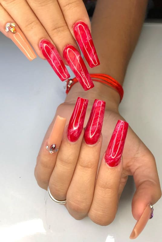 Long red acrylic marble nails