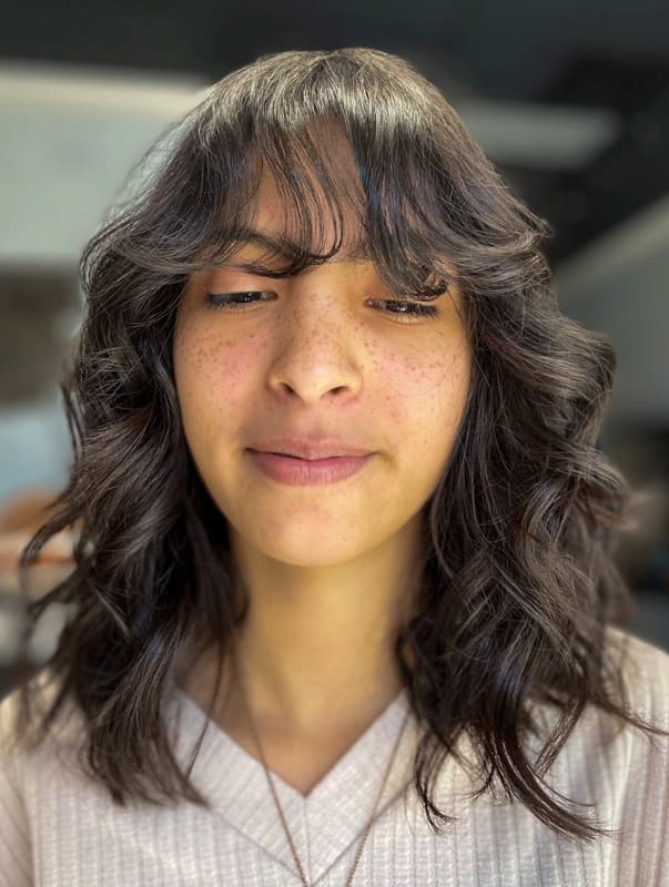 Medium wolf cut curly hair with bangs