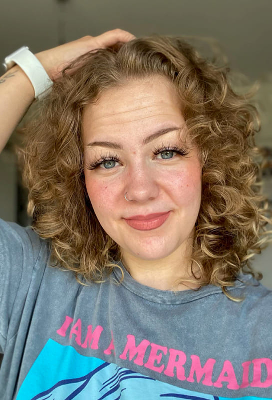 Short wolf cut curly blonde hair