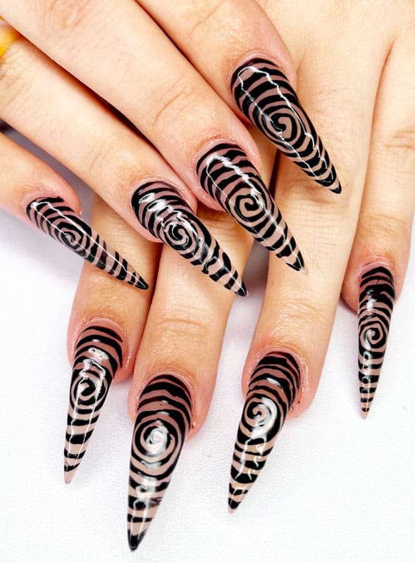 Hypnotic black and nude nails